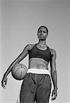 Portrait of Woman Holding Basketball Outdoors