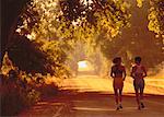 Back View of Women Running Along Road, Boulder, Colorado, USA