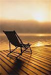 Beach Chair on Dock at Sunrise Meech Lake, Quebec, Canada