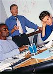 Businessman Giving Presentation Using White Board