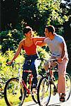 Couple Riding Bicycles Side by Side on Pathway