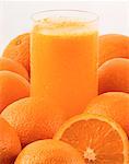 Glass of Orange Juice and Oranges