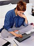 Woman Sitting on Bed Using Laptop Computer