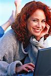 Portrait of Woman Lying Down Using Laptop Computer Outdoors