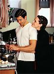 Couple in Kitchen, Man Preparing Salad