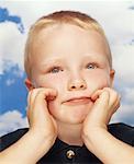 Portrait of Boy with Hands on Chin