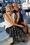 Portrait of Mature Couple Sitting On Boat