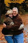 Portrait of Mature Couple Embracing Outdoors in Autumn