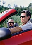 Mature Couple Sitting in Convertible