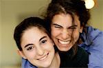 Portrait of Two Teenage Girls Smiling