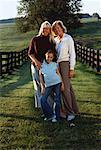 Portrait of Grandmother, Mother And Daughter Standing in Field