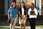 Portrait of Three Teenage Girls Standing Outdoors