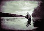 Man Fly Fishing Kennebec River, Maine, USA