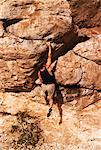 Back View of Man Rock Climbing