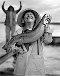 Portrait of Mature Man Holding Fish
