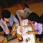 Overhead View of Business People Working at Table