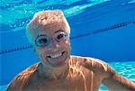 Portrait of Mature Man Underwater In Swimming Pool