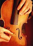 Luthier's Hands Making Violin