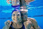 Portrait of Mature Couple Underwater in Swimming Pool