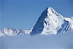 Summit of Mount Eiger and Clouds Switzerland