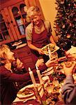 Grandmother Serving Christmas Dinner to Family