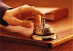 Close-Up of Hand Ringing Service Bell