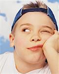 Portrait of Boy Wearing Baseball Cap Backwards - Stock Photo - Masterfile -  Rights-Managed, Artist: Dan Lim, Code: 700-00057787