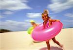 Portrait of Girl in Swimwear on Beach with Inner Tube Miami Beach, Florida, USA