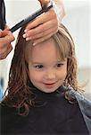 Portrait of Girl Having Hair Cut