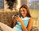 Portrait of Woman Sitting on Sofa Holding Mug