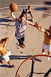 Men Playing Basketball Outdoors