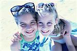 Portrait of Two Girls in Swimwear On Beach