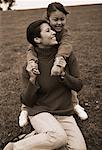 Mother and Daughter Playing Outdoors, Laughing