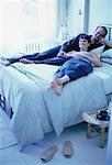 Couple Relaxing on Bed