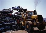 Forklift Placing Smashed Car on Stack