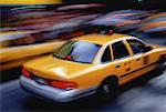 Taxi and Blurred Traffic on City Street, New York, New York, USA