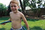 Portrait of Boy with Hula Hoop Outdoors