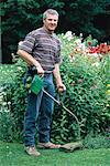 Portrait of Male Gardener near Flowers, Ontario, Canada
