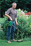 Portrait of Male Gardener near Flowers, Ontario, Canada - Stock