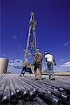 Back View of Workers on Gas Drilling Rig