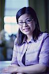 Portrait of Woman Sitting at Desk