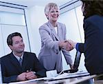 Business People in Meeting Shaking Hands