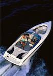 Couple en bateau, excès de vitesse sur l'eau, Miami, Florida, USA