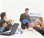 Businessman Giving Presentation In Boardroom