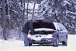 Mature Man with Stalled Car at Roadside in Winter, ON, Canada