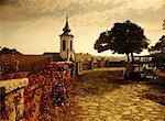 Mature Woman Sitting near Walkway And Church, Budapest, Hungary