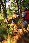 Back View of Couple Hiking in Forest, Belgrade Lakes, ME, USA