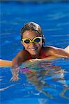 Portrait of Girl in Swimwear and Goggles in Swimming Pool