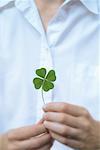 Woman Holding Four Leaf Clover