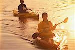 Man and Woman Kayaking at Sunset Belgrade Lakes, Maine, USA